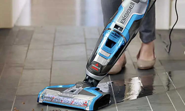 why is it preferable to use a vacuum to clean tiles?
