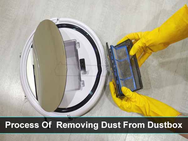 man removing dust from vacuum cleaner dust box